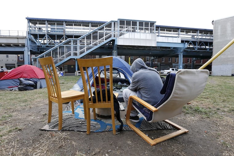 A person who didn’t want to be identified uses heroin in a lot near Somerset Street and Kensington Avenue in Philadelphia, PA on October 13, 2017.