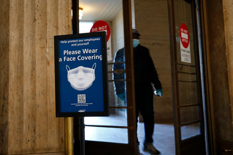 Signs at 30th Street Station ask visitors to wear face mask. Amtrak now says it will ban customers who don't comply with the requirement.