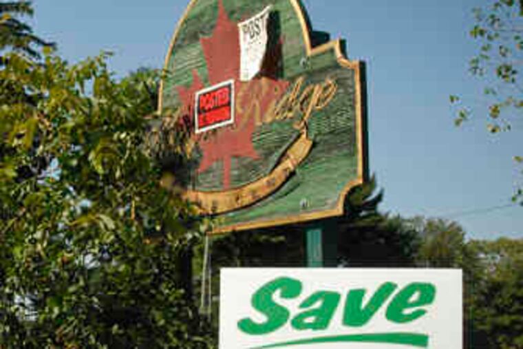 A Friends of Maple Ridge signat the former golf club urges thatthe 112-acre site be preserved.