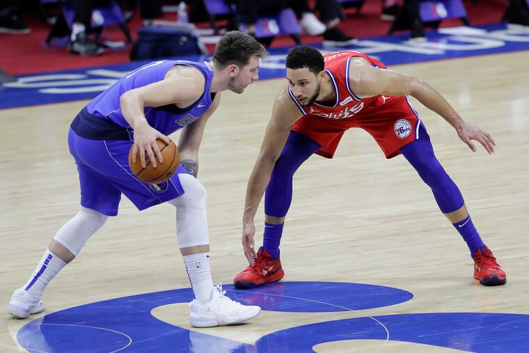 Sixers guard Ben Simmons defends Dallas Mavericks guard Luka Doncic on Feb. 25.
