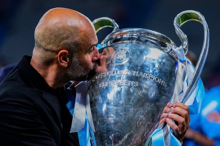 Manchester City manager Pep Guardiola kisses the trophy after winning the Champions League final earlier this month. City will play in the 2025 Club World Cup in the United States.