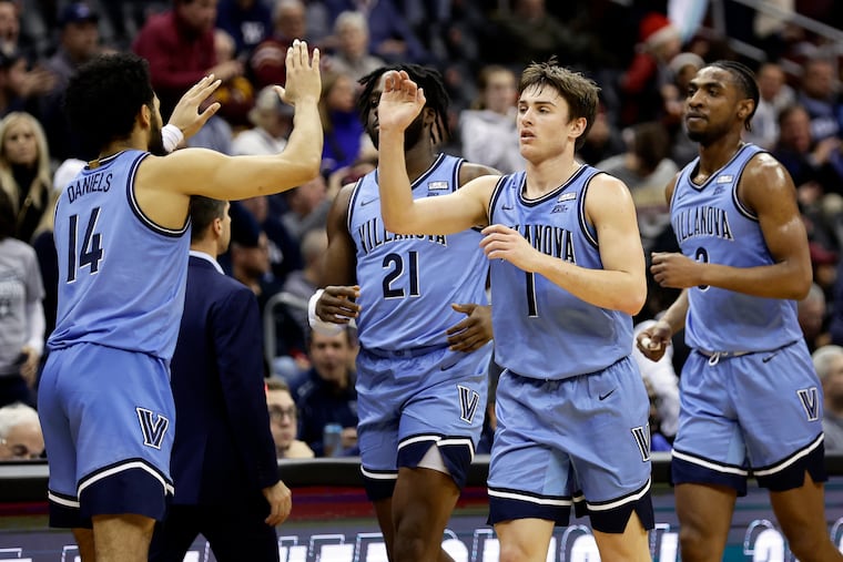 Villanova Brendan Hausen (1) high-fives Caleb Daniels (14) after Villanova defeated Boston College, 77-56, on Saturday.