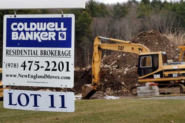 A house under construction in North Andover, Mass., in December, when sales of new U.S. homes dropped 7.3 percent from November, to a seasonally adjusted annual rate of 369,000. (Elise Amendola / AP)