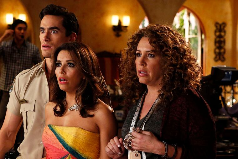 NBC's "Telenovela," among other current TV series that include Latino culture, stars Eva Longoria (center) with Jose Moreno Brooks and Diana Maria Riva.