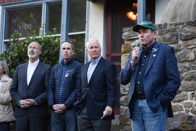 On November 3, 2018, Democrat Scott Wallace (right) stumped for votes at a bus tour in Chalfont with Gov. Tom Wolf (left) and U.S. Sen. Bob Casey.