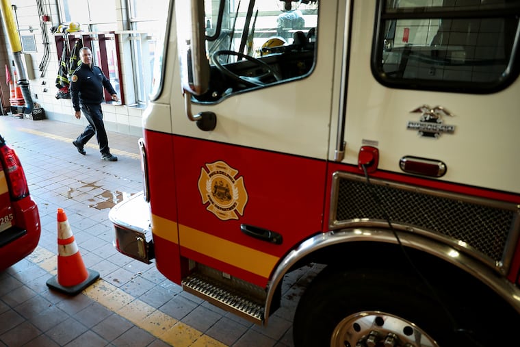 In this 2019 file photo, Philadelphia Fire Commissioner Adam Thiel walks by Engine 1 during a visit to the firehouse at Broad and Fitzwater Streets.