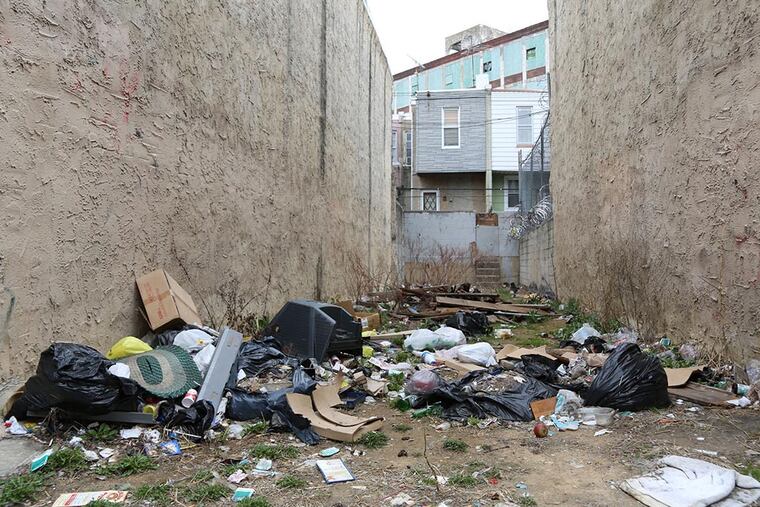 Littering and illegal dumping are major sources of blight in Kensington and other parts of the city. Would more garbage cans alleviate the problem, or just attract more dumpers who trash up the place? (JAMIE MOFFETT)
