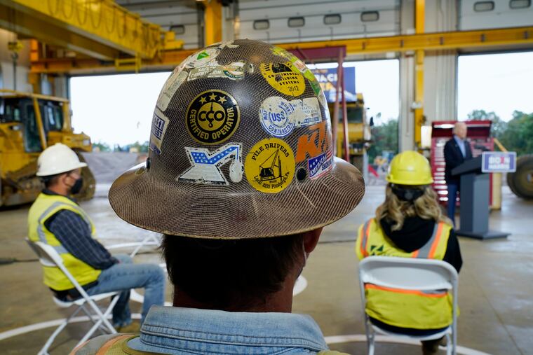 People listen as Democratic presidential candidate former Vice President Joe Biden speaks after touring International Union of Operating Engineers Local 66, Wednesday, Sept. 30, 2020, in New Alexandria, Pa. Biden is on a train tour through Ohio and Pennsylvania today.