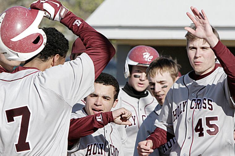 Holy Cross junior Brandon Simmons arrives at home plate after hitting a three-run home run in the sixth inning against Paul VI. (Elizabeth Robertson/Staff Photographer)