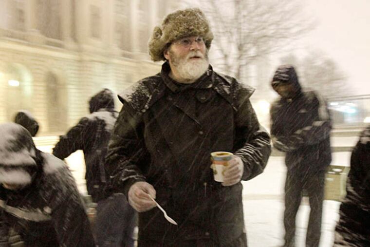 Cranford Coulter of Souderton serves his homemade soup to hungry people along Vine Street between 18th and 19th Streets during a visit this year. (Elizabeth Robertson/Staff/File)