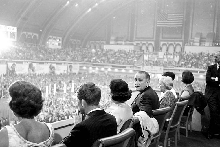 This is the view President Lyndon Johnson and his guests had of the closing session of the Democratic convention in Atlantic City, August 27, 1964. Left to right: Ethel Kennedy and her husband, Robert F. Kennedy; Mrs. Johnson, the President, Mrs. Hubert Humphrey, Luci Johnson, and Lynda Johnson. (AP Photo/John Rous)