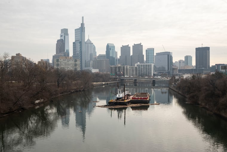 Debris collects on barges in the Schuylkill in January.