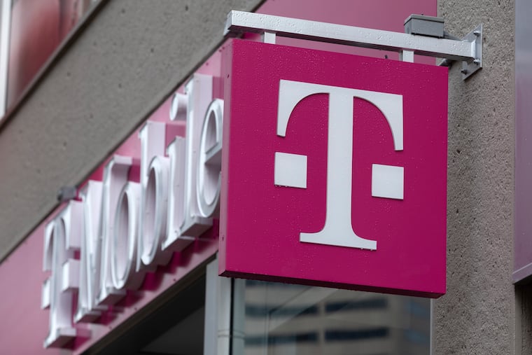 The T-Mobile logo is seen on a storefront in 2022 in Boston.