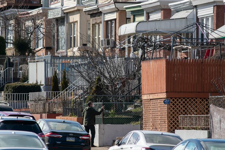 A detective along 4700 block of Whitaker Avenue in Philadelphia, close to where a man was shot and killed Monday morning.