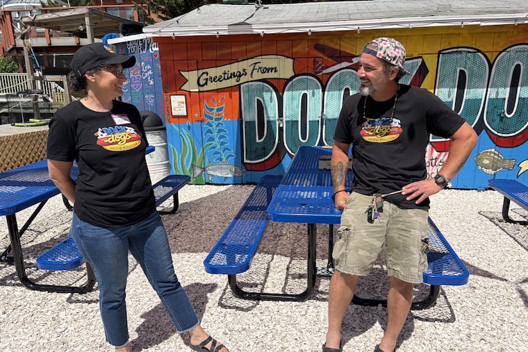 Hillary Bor, left, and Tim Nedzwecky, at their hot dog stand on the bay in Margate, Docks Dogs. Bor is the former owner of Pumpkin BYOB in Philadelphia, which closed in 2024.