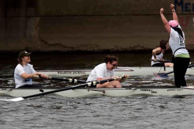 Coxswain Wendy Zalles cheers after sheand the restof her teamfrom Vanguard won in thenovice divisionof the Aberdeen Dad Vail Regatta's corporate challenge.