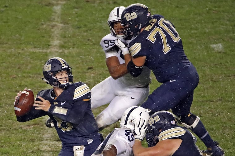 Pittsburgh quarterback Kenny Pickett, left, throws a pass during the first half of an NCAA college football game against the Penn State in Pittsburgh, Saturday, Sept. 8, 2018. (AP Photo/Gene J. Puskar)