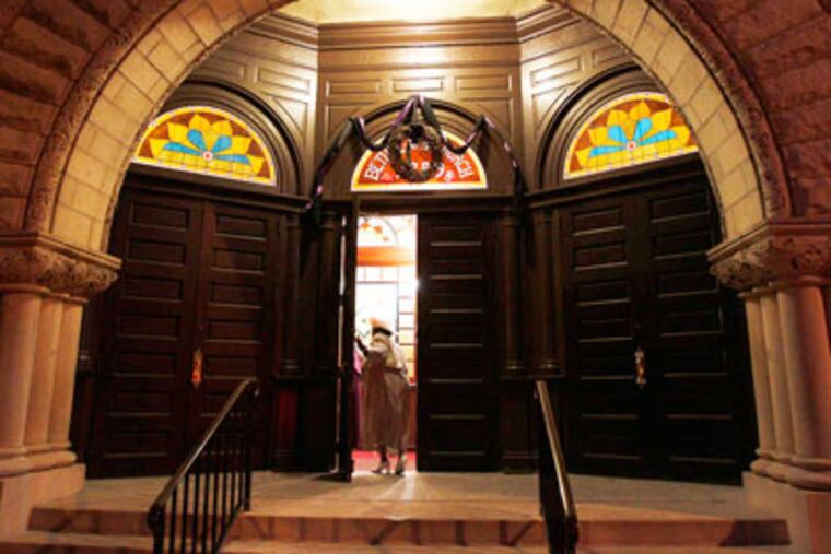 A worshiper arrives for sunrise Easter service at Mother Bethel A.M.E. Church in Philadelphia. (David Maialetti / Staff Photographer)