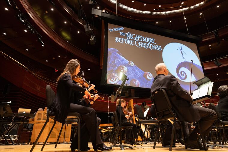 The Philadelphia Orchestra warms up before its live-to-screen performance of the score to Tim Burton's classic film "The Nightmare Before Christmas" at Verizon Hall on Friday.