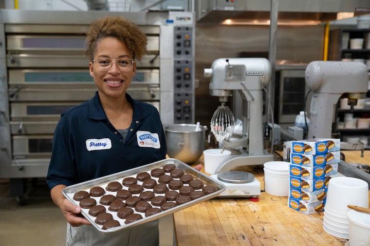 Shelley McDonnough, product development coordinator for Tastykake, shown here with fresh Kandy Kakes, at Tasty Baking Company's Navy Yard bakery.