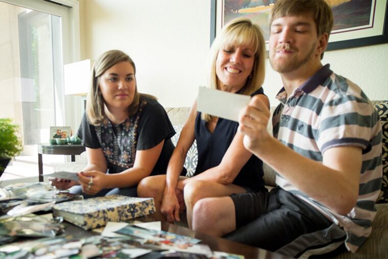 Susan Sheridan (center) with her daughter Mackenzie and son Cal, who suffered brain damage when his newborn jaundice was overlooked.