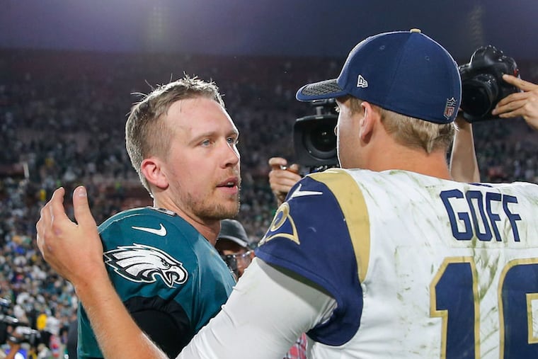 Eagles quarterback Nick Foles meets Los Angeles Rams quarterback Jared Goff after the Eagles 43-35 on Sunday, December 10, 2017. YONG KIM / Staff Photographer