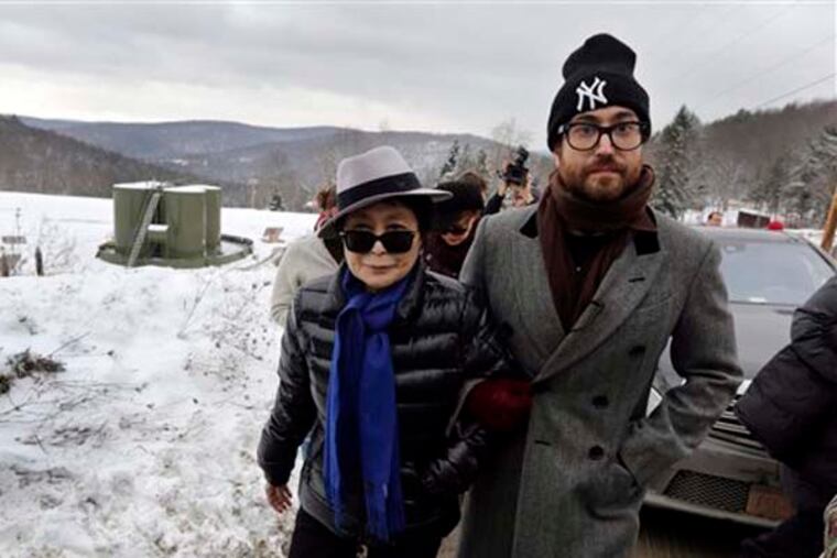 In this file photo of Jan. 17, 2013, Yoko Ono, left, and her son Sean Lennon visit a fracking site in Franklin Forks, Pa., during a bus tour of natural-gas drilling sites in northeastern Pennsylvania. Ono and Lennon have formed a group called ìArtists Against Fracking,î which has become the main celebrity driven anti-fracking organization. (AP Photo/Richard Drew, File)