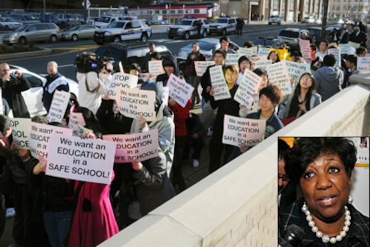 Students and community members walk up Broad Street in December to protest recent violence at South Philadelphia High School. Schools superintendent Arlene Ackerman (inset) said Tuesday that the attack stems from a "citywide violence problem."