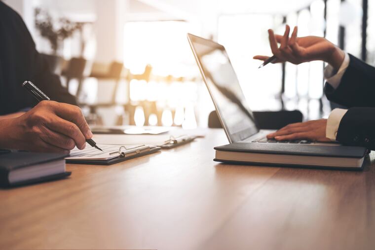 Two businessmen at work, Business crew working with new startup financial project plan,man and woman discussion information with laptop and digital tablet in a modern business lounge,Selective Focus.