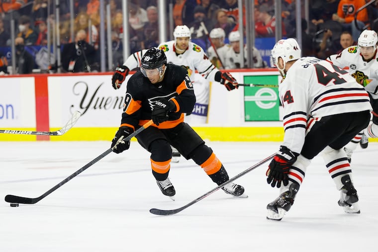 Flyers right wing Cam Atkinson skates with the puck against the Chicago Blackhawks on Saturday.