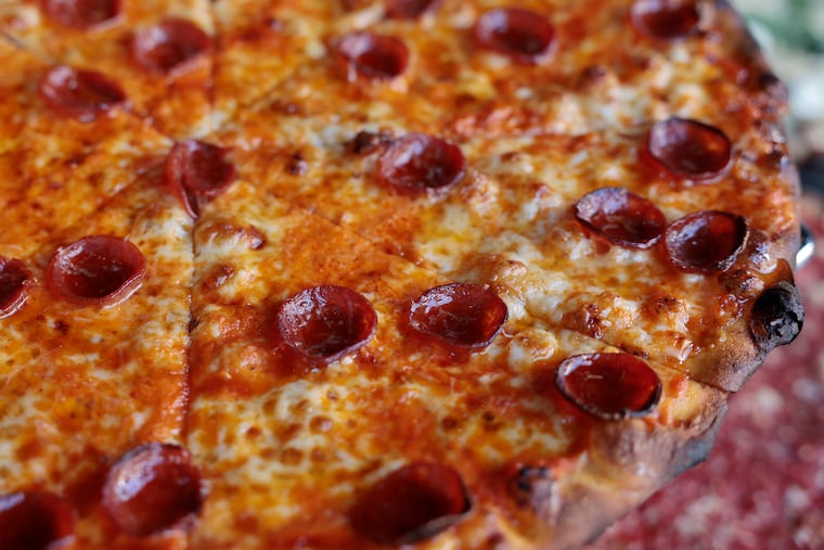 The Classic Tomato Pie with crushed tomatoes, mozzarella, garlic, pepperoni and Mike’s Hot Honey at CJ & D's Trenton Tomato Pies, 1326 E Passyunk Ave. 