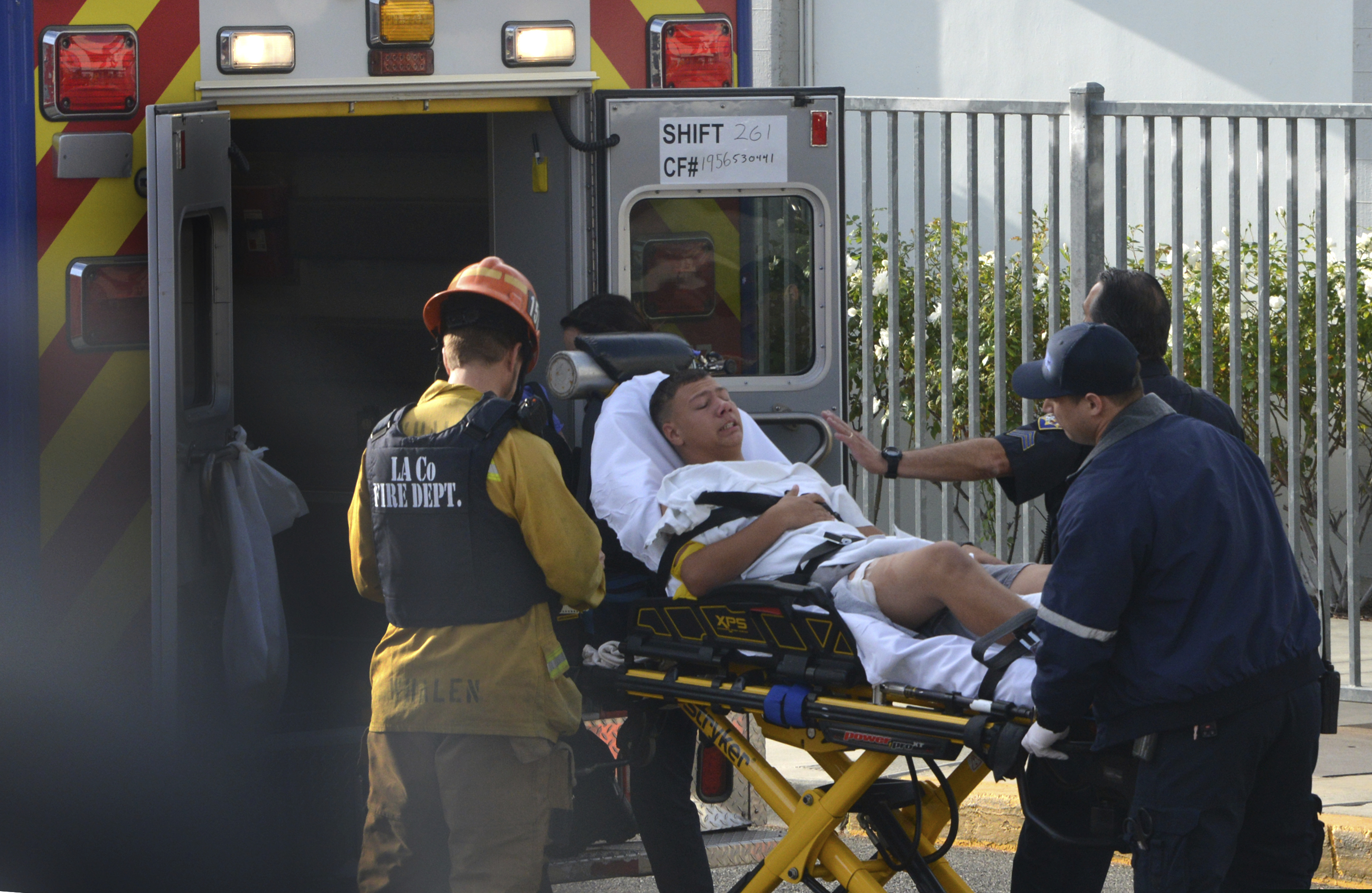 Medical personnel load an injured person into an ambulance outside Saugus High School in Santa Clarita, Calif., after a student gunman opened fire at the school on Thursday.