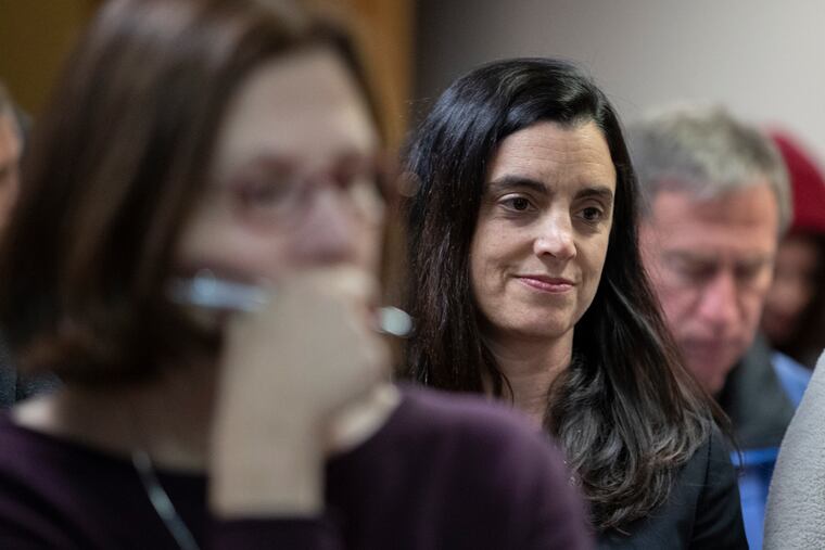 City Controller Rebecca Rhynhart sits in the crowd and listens as Philadelphia city commissioners speak on their decision to vote in favor of new voting machines during a hearing Wednesday, Feb. 20, 2019.