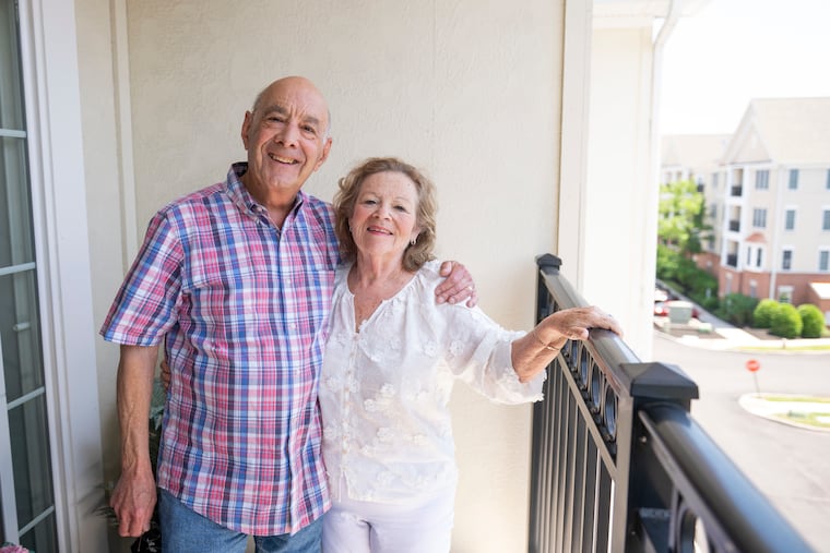 Fred and Barbara Zucker on their balcony at their apartment at the Plaza Grande complex in Cherry Hill.