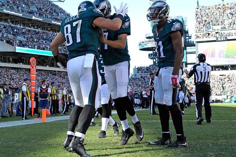 Philadelphia Eagles tight end Brent Celek (87) celebrates a 13-yard touchdown catch with quarterback Sam Bradford (7) and wide receiver Jordan Matthews (81) during the third quarter against the New Orleans Saints at Lincoln Financial Field.