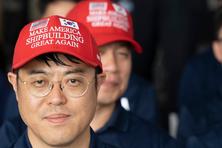 Hanwha Philly Shipyard worker Jeon Jonghyun, visiting from South Korea, looks on prior to the christening ceremony for the TS State of Maine in South Philadelphia in August.