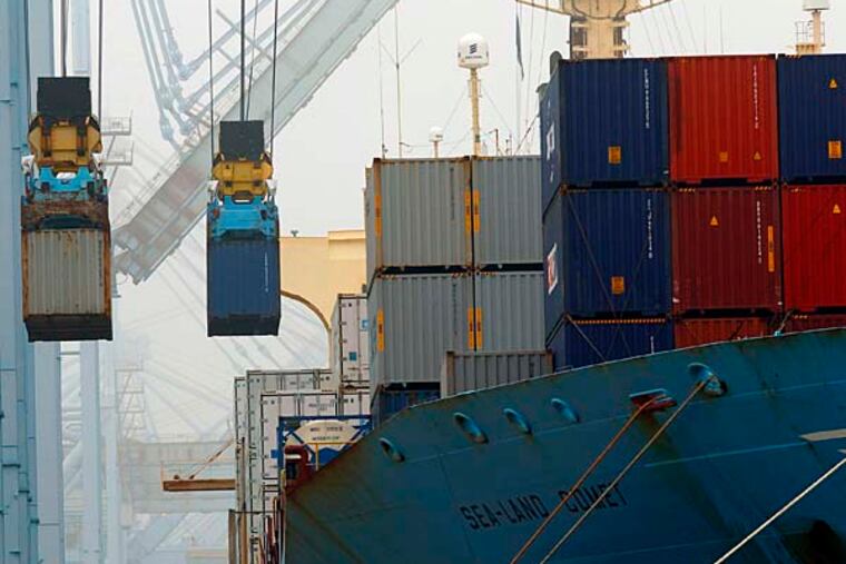 Containers unloaded from cargo ships at APM Terninals in the Port of Los Angeles on Wednesday, Dec. 5, 2012. Work resumed at the Los Angeles and Long Beach harbors after settlement of a strike that crippled the nation's busiest container port complex for more than a week. (AP Photo/Nick Ut)