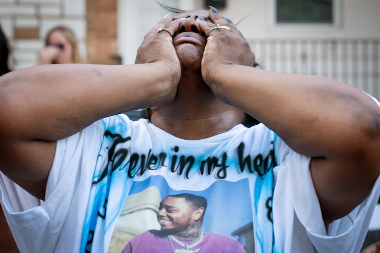 Kathi Camp is overwhelmed with grief during a balloon release for her son Diniar in August 2022 in South Philadelphia.