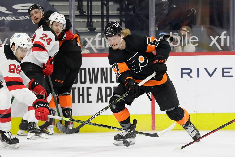 Flyers right winger Wade Allison skates after the puck against New Jersey Devils defenseman Kevin Bahl in a game on May 1.