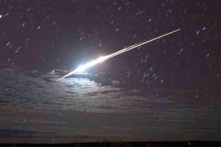 Two streaks mark the return of Japan's Hayabusa probe and its capsule through Earth's atmosphere to Australia. The spacecraft was the first to complete a round-trip to an asteroid.