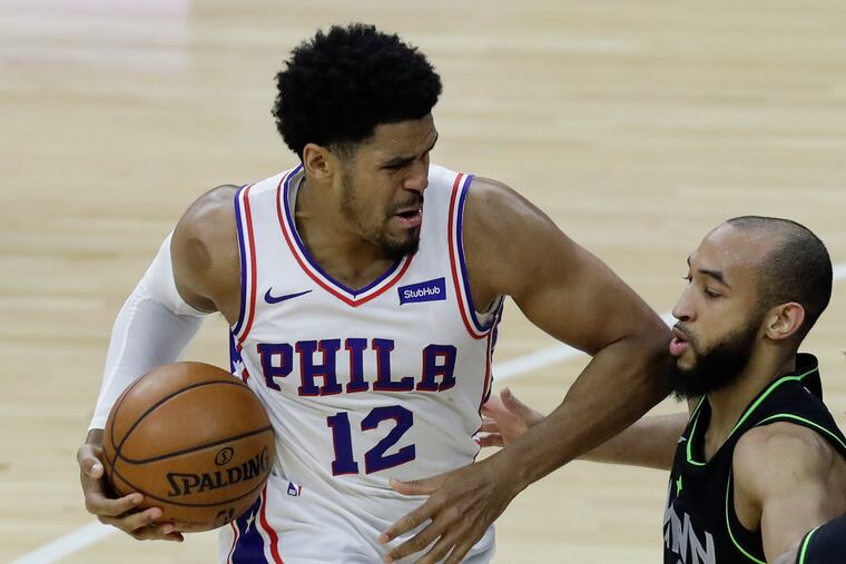 Sixers forward Tobias Harris working against Minnesota Timberwolves guard Jordan McLaughlin during the third quarter April 3.