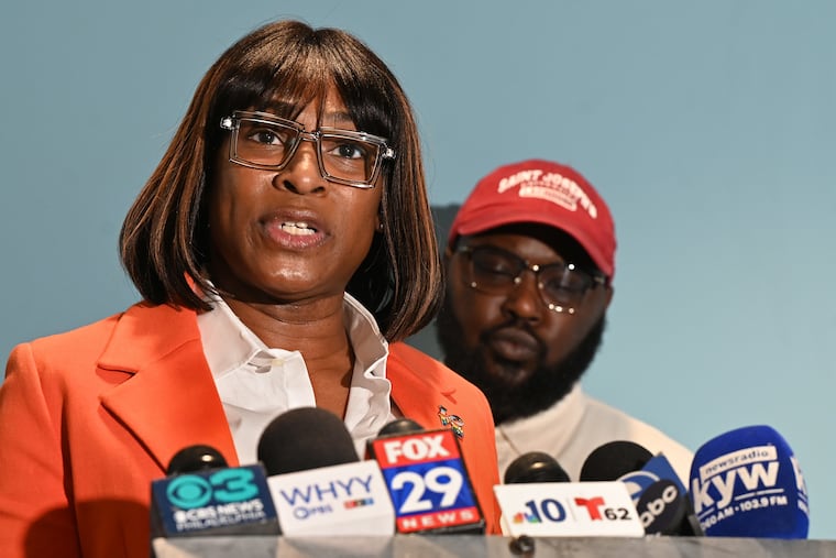 Celena Morrison (left) and Darius McLean read a statement during a news conference in March. The married LGBTQ leaders were arrested during a contentious traffic stop over the weekend. Morrison recently left her job as the city's executive director of the Office of LGBTQ Affairs.