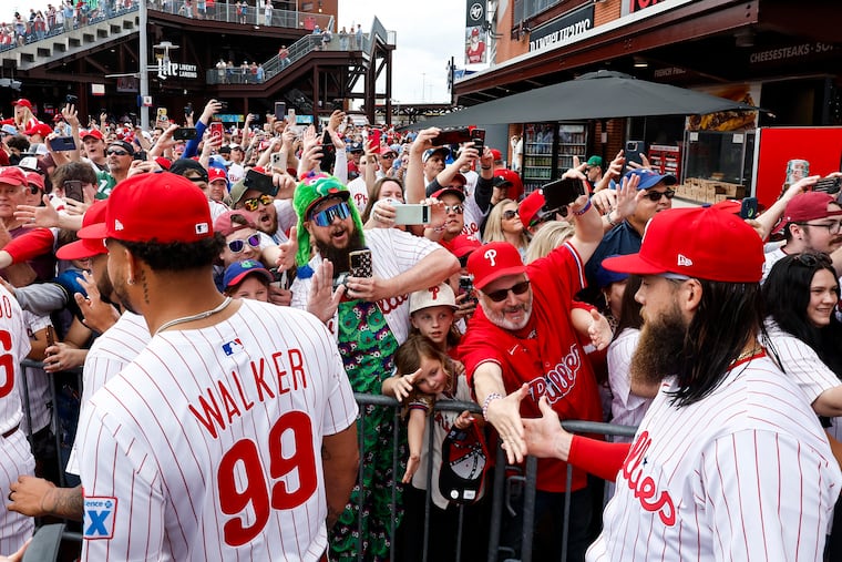 Fans greet Philadelphia Phillies center fielder Brandon Marsh at Ashburn Alley before the home opener at Citizens Bank Park last year. The weather is looking decent for the 2026 season opener.