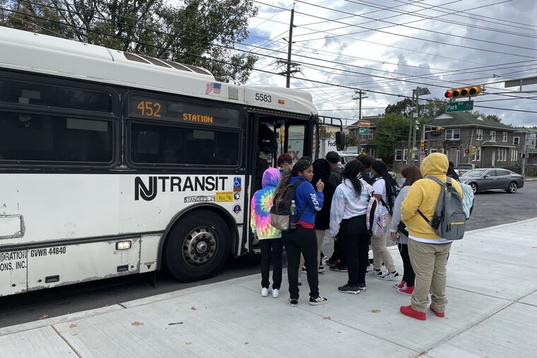 Students from Camden High board a NJ Transit bus after school on Wednesday, Sept. 22, 2021. Because of a severe school bus driver shortage, the district has provided bus passes for students to use public transportation.