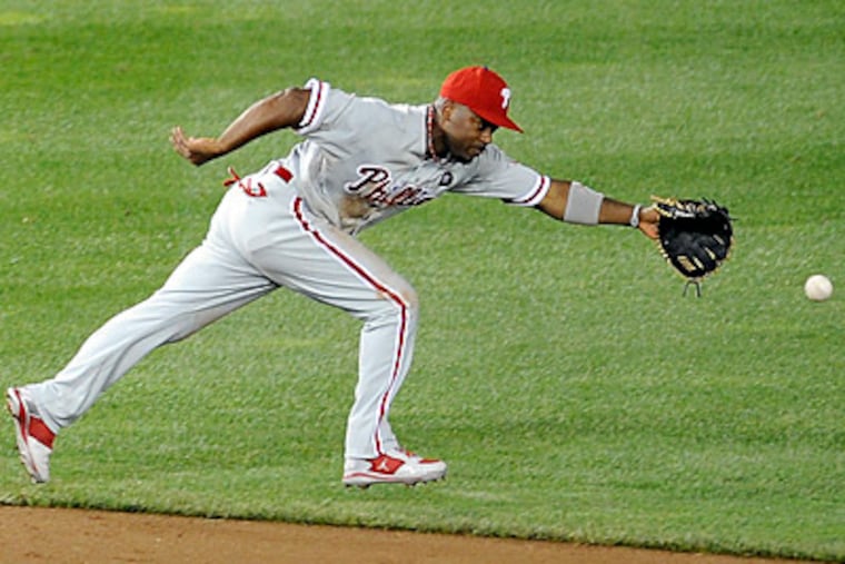 Jimmy Rollins will have an MRI exam today after suffering a groin injury yesterday. (Nick Wass/AP)