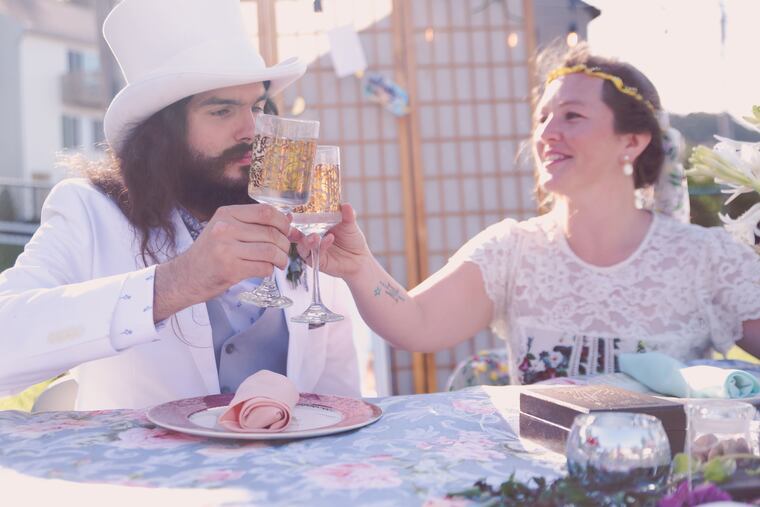 The bride and groom offer each other a toast.