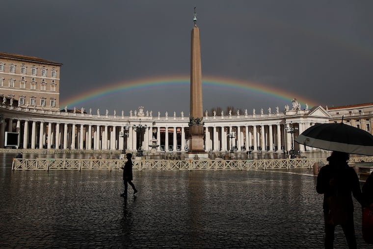 A rainbow shines over St.Peter's Square at the Vatican, on Jan. 31, 2021. A Vatican official has apologized to a leading Catholic LGBTQ advocacy group for having yanked a reference to it on the Vatican website.