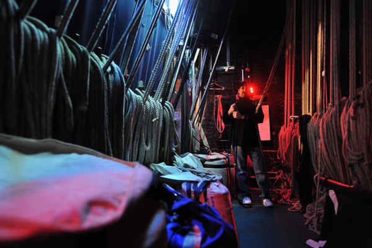 One of America's few remaining "hemp house" theaters, the Walnut Street Theatre uses a system of ropes and sandbags to raise and lower scenery. Sal DiNapoli, head flyman, mans the ropes and sandbags backstage during a production of "A Streetcar Named Desire."