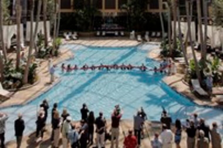 The Pool at Harrah's, a 172,000-square-foot entertainment complex with indoor pool, opened yesterday in Atlantic City. In the pool, casino managers and bikini-clad servers cut a ribbon.