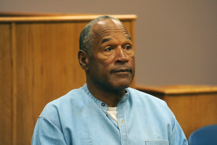FILE - In this July 20, 2017 file photo, former NFL football star O.J. Simpson appears via video for his parole hearing at the Lovelock Correctional Center in Lovelock, Nev. Simpson has launched a Twitter account with a video post in which the former football star says he’s got a “little gettin’ even to do.” Simpson confirmed the new account to The Associated Press on Saturday, June 15, 2019. Simpson said in a phone interview it will be a lot of fun and that he had some things to straighten out. (Jason Bean/The Reno Gazette-Journal via AP, Pool, File)